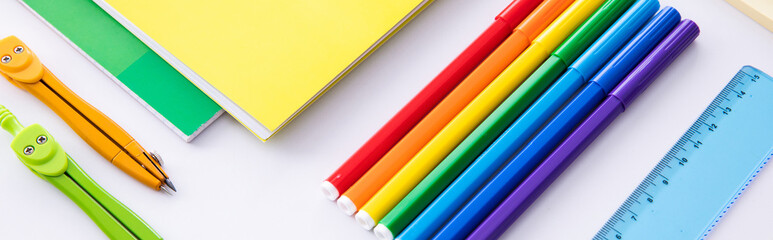collection of bright colorful stationery on light background, close view . High quality photo