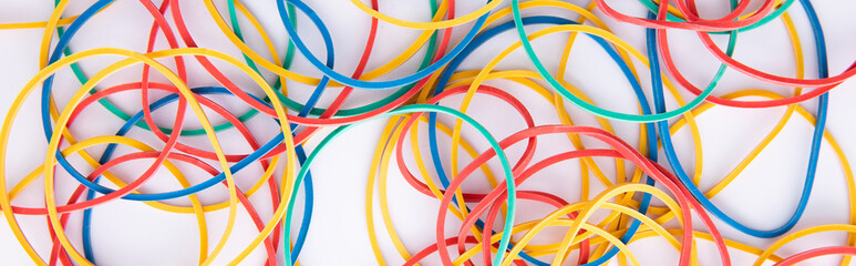 bright colorful stationery rubber bands isolated on white background, close view. High quality photo