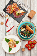 Top view of a cooked served dishes of restaurant's menu