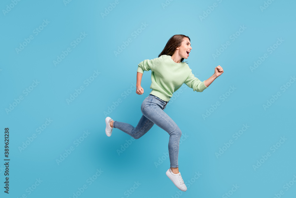 Poster full length body size side profile photo of cheerful female student running fast hurrying up jumping