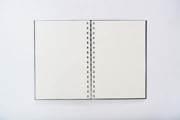 open notebook top view empty on white background