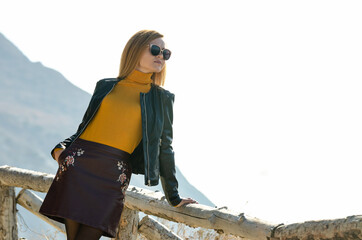 Girl tourist enjoying the view from the mountain