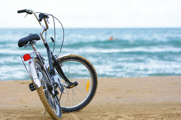 Close-up bike stands on the sea coast
