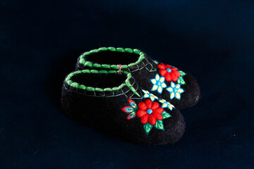 Slippers made of wool,embroidered by the method of felting