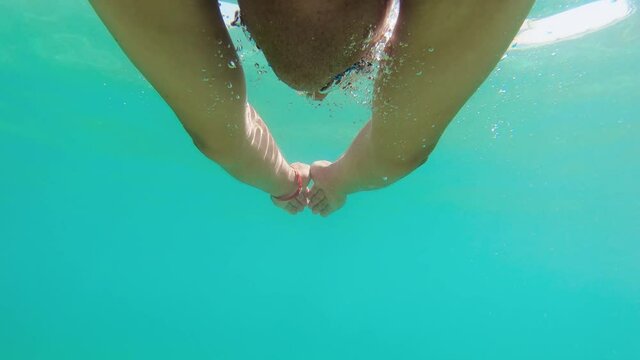 Man swimming with breast stroke style than continue with freestyle, slow motion