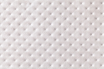 Texture of white leather background with capitone pattern, macro.