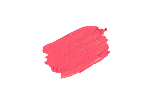 Red-pink isolated Swatch of lipstick on a white background. A smear of makeup. The base for makeup has a creamy texture.