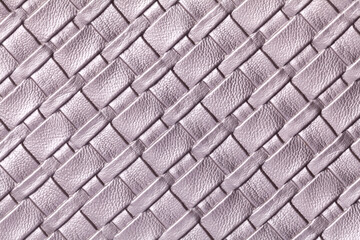 Texture of light purple leather background with wicker pattern, macro.