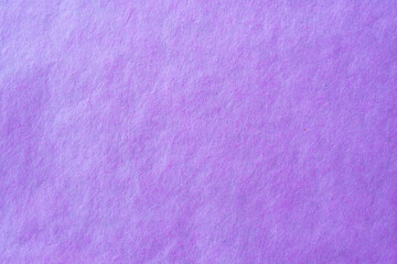 Purple crumpled paper texture background.