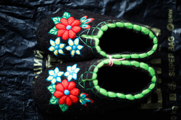 Slippers made of wool,embroidered by the method of felting
