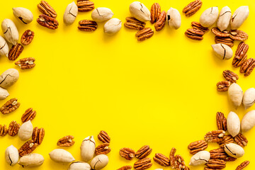 Frame of pecan nuts. Food background, top view
