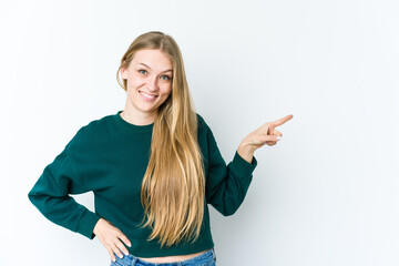Young blonde woman isolated on white background smiling cheerfully pointing with forefinger away.