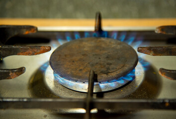 Burning blue flames gas. Hotplate on the home stove.