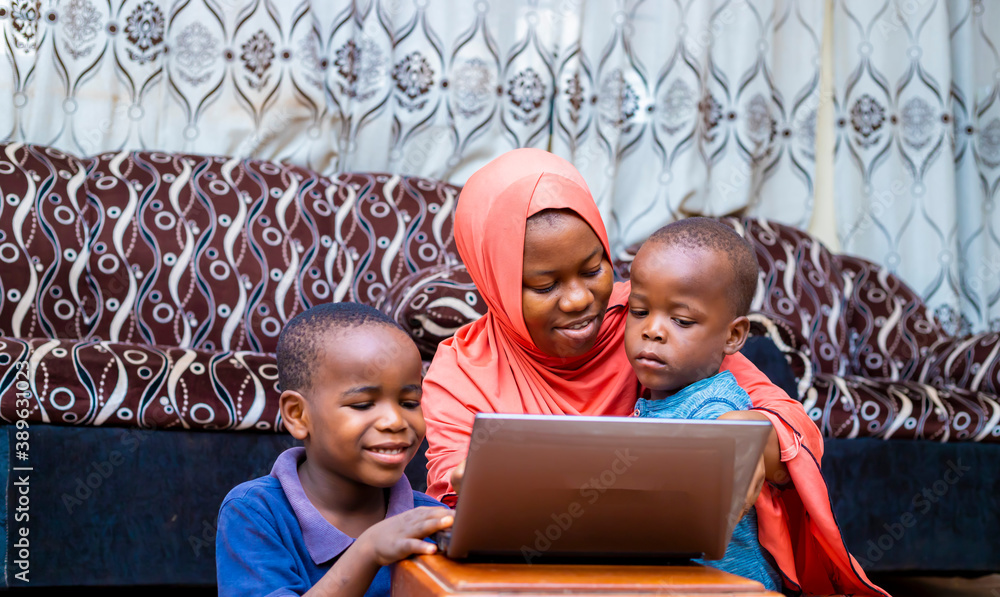 Wall mural black african family using laptop at home