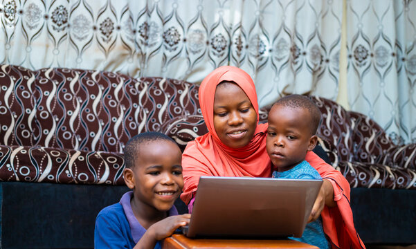 black african family doing home schooling with digital laptop during quarantine period
