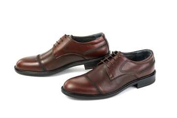 Classic brown leather shoes on a white background