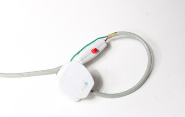 A very dangerous wrongly wired electrical wire cable. Badly wired wires are responsible for house and commercial building fires. Old electrical wiring on vintage and retro plugs.