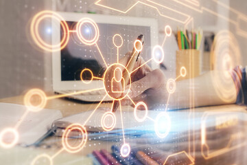 Social network theme hologram over woman's hands writing background. Concept of international people connect. Double exposure
