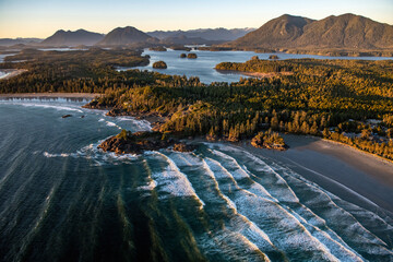 Fototapeta premium Landscape of Tofino covered in greenery surrounded by the sea in the Vancouver Islands, Canada
