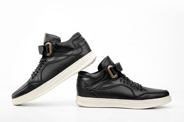 A pair of men's black shoes on white background