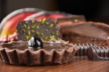 Pile heap of various cakes stock images. Chocolate tart with cherries images. Different types of desserts stock photo. Creamy chocolate cakes images