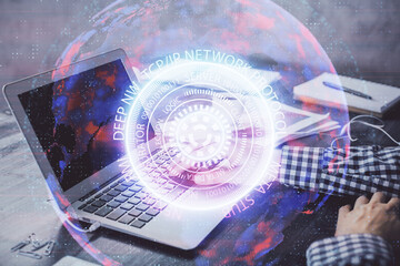 Technology theme hologram with man working on computer on background. High tech concept. Double exposure.