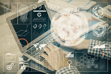 Businessman with computer background with technology theme hologram. Concept of hightech. Multi exposure.