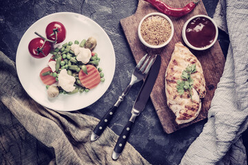 Fried chicken fillet and boiled vegetables