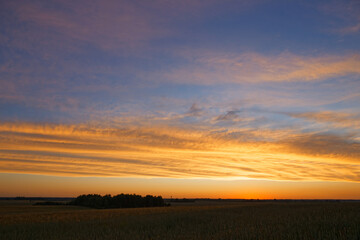 sunset of the red sun on a variegated colored sky