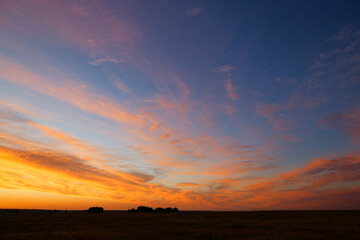 sunset of the red sun on a variegated colored sky