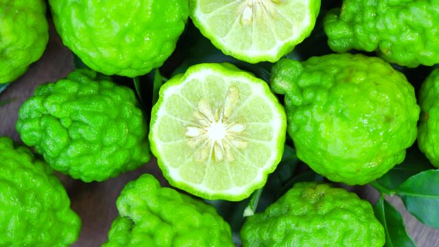 Top view Rotate of Transparent Slice of Bergamot fruit  on white background, Close up fresh Bergamot sliced on white background and slowly rotating.