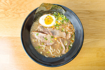 Asian noodle soup with meat and sesame seeds