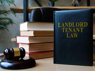 Landlord tenant law book on the lawyer desk. - obrazy, fototapety, plakaty
