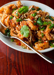 Calamari served with spicy and sweet dipping sauces. Classic American restaurant or French bistro appetizer favorite. Fresh octopus, squid and shrimp battered and deposed fried.