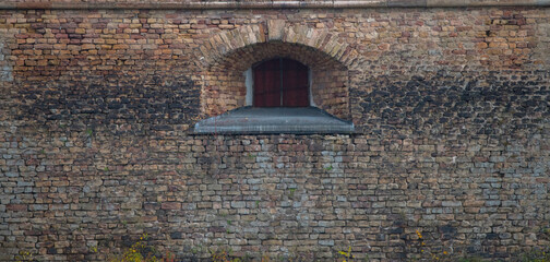 Windows on a old watch tower at a quay at the passage Oxdjupet in the Stockholm archipelago