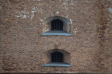 Fototapeta na wymiar Windows on a old watch tower at a quay at the passage Oxdjupet in the Stockholm archipelago