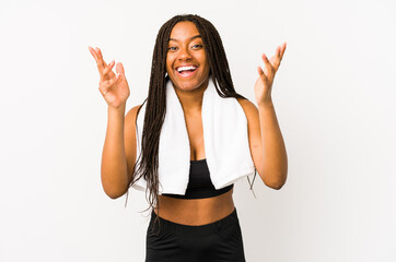 Young african american sport woman isolated receiving a pleasant surprise, excited and raising...