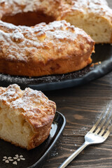 Delicious and fragrant crispy cupcake with apple pieces on a wooden table