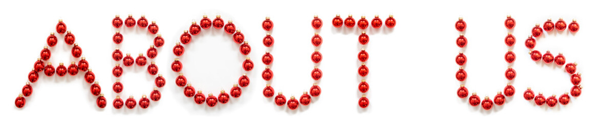 Red Christmas Ball Ornament Building English Word About Us. Festive Christmas Decoration. White Isolated Background