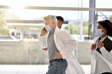 Medical team in emergency department rushing in hallway