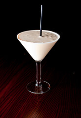 Dessert Cocktail. Alcoholic Drinks made with gin, vodka, rum or whiskey mixed with soda water, fruit juices and garnishes with limes and cherries. Classic American bar drinks.