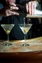 Old Fashioned Cocktail. Traditional American craft cocktails made by artisanal bartenders or mixologists in speakeasy & upscale bars or dive bar taverns. Cocktails served in chilled cocktail glass.