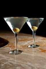 Old Fashioned Cocktail. Traditional American craft cocktails made by artisanal bartenders or mixologists in speakeasy & upscale bars or dive bar taverns. Cocktails served in chilled cocktail glass.