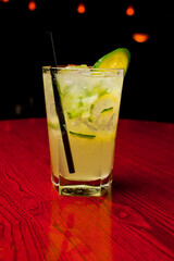 Cocktails. Traditional American drinks made by artisanal bartenders or mixologists in speakeasy & upscale bars or dives or taverns.Cocktails served in chilled cocktail glasses & garnished with fruit.