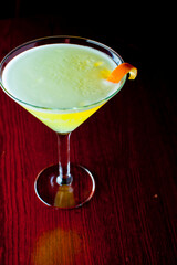 Cocktails. Traditional American drinks made by artisanal bartenders or mixologists in speakeasy & upscale bars or dives or taverns.Cocktails served in chilled cocktail glasses & garnished with fruit.