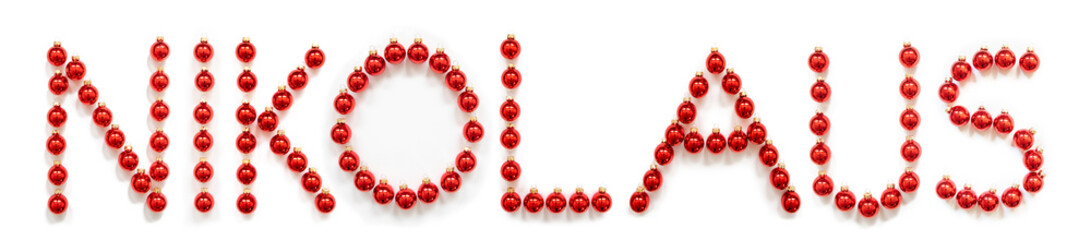 Red Christmas Ball Ornament Building German Word Nikolaus Means Santa Claus. Festive Christmas Decoration. White Isolated Background