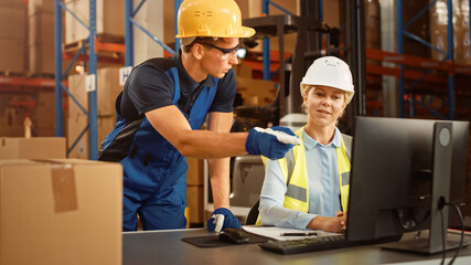 In Retail Warehouse Manager Uses Computer with Inventory Checking Software, Talks with Storehouse Worker about Package Delivery. International Distribution Center with Shelves Full of Products 