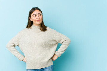 Young caucasian woman dreaming of achieving goals and purposes
