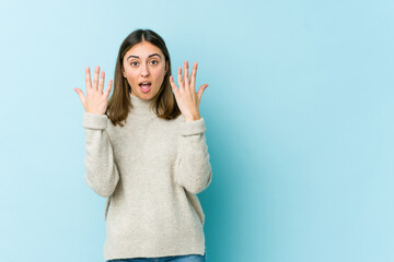 Young caucasian woman showing number ten with hands.