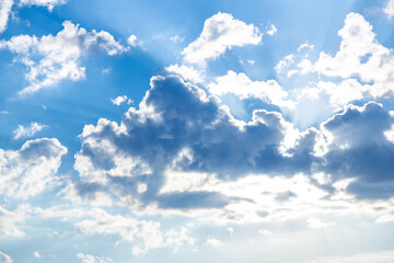 White clouds on blue dramatic sky Sunbeam, background look  abstract nature.